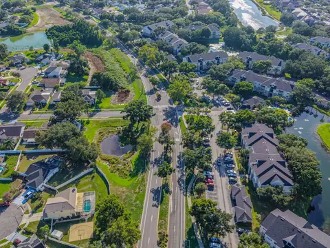 An aerial view of a Florida neighborhood of homes, ponds and winding streets
